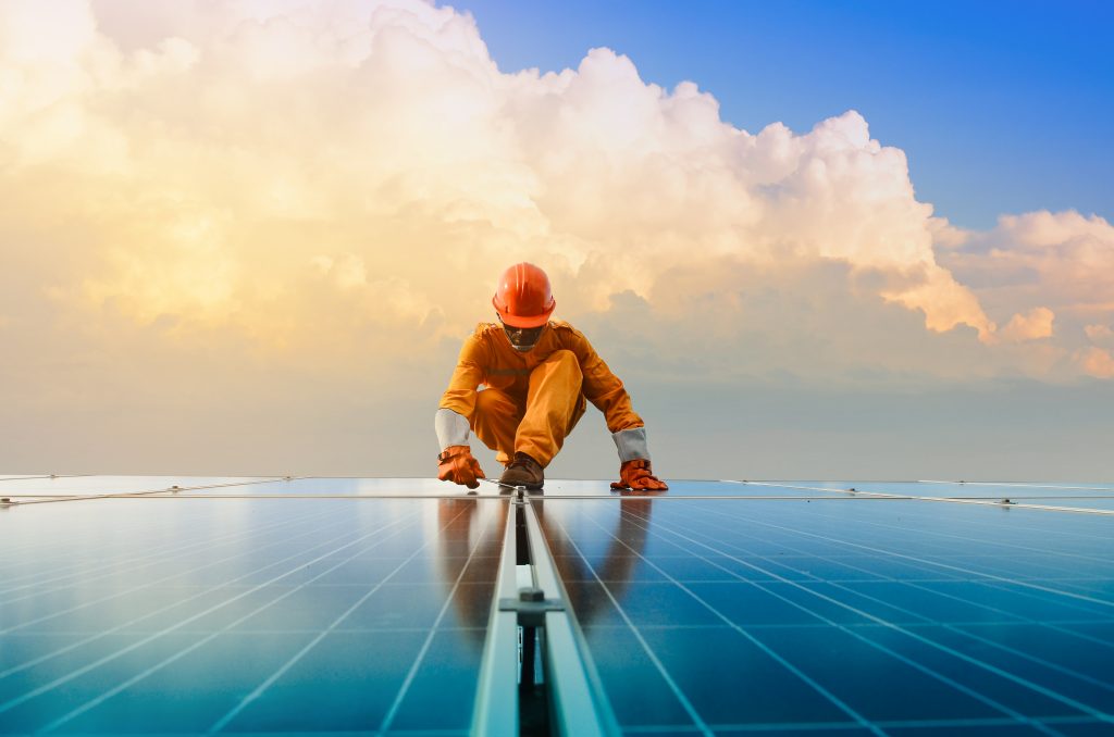 Man fitting solar panels