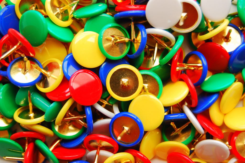 A pile of multi-coloured pins